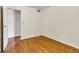 A well-lit bedroom boasts beautiful hardwood floors and offers a peaceful retreat at 518 N Carr Rd, Plainfield, IN 46168