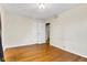 Bright bedroom with hardwood flooring, ample space, and easy access to closet and hallway at 518 N Carr Rd, Plainfield, IN 46168