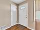 Inviting foyer with hardwood floors, a white front door, and a classic, clean design at 518 N Carr Rd, Plainfield, IN 46168