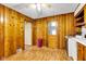 Eat-in kitchen with linoleum floors and wood paneling walls at 518 N Carr Rd, Plainfield, IN 46168