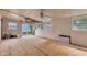 Large living room featuring unfinished floors, white walls, and sliding glass door at 518 N Carr Rd, Plainfield, IN 46168