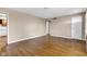 Bright living room showcases beautiful hardwood floors, offering a versatile space for relaxation and entertainment at 518 N Carr Rd, Plainfield, IN 46168