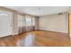 Spacious living area with hardwood floors, neutral tones, and ample natural light, providing a blank canvas for personalization at 518 N Carr Rd, Plainfield, IN 46168