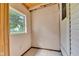 An empty room with a window shows the potential for customization and natural light at 518 N Carr Rd, Plainfield, IN 46168