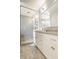 Bright bathroom featuring an oversized shower, large vanity with lots of storage, and modern fixtures at 5219 N New Jersey St, Indianapolis, IN 46220