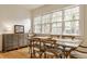 Cozy dining area featuring rustic table with chairs and natural light at 5219 N New Jersey St, Indianapolis, IN 46220