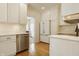 Bright kitchen with stainless steel appliances and hardwood floors at 5219 N New Jersey St, Indianapolis, IN 46220