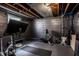 Basement gym with exercise bike, rowing machine, and dark painted walls at 5280 N Capitol Ave, Indianapolis, IN 46208