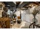 Spacious basement area with white cabinets and a decorative arrangement of seating and plants at 5280 N Capitol Ave, Indianapolis, IN 46208