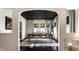 Elegant dining room featuring a black ceiling, modern chandelier, and neutral-toned curtains at 5280 N Capitol Ave, Indianapolis, IN 46208