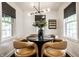 Bright dining room featuring a round table, stylish chairs, and a modern chandelier at 5280 N Capitol Ave, Indianapolis, IN 46208