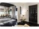 Bright entryway featuring black doors, a modern table, and stylish decor at 5280 N Capitol Ave, Indianapolis, IN 46208