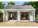 Open garage with stylish seating area and garden view at 5280 N Capitol Ave, Indianapolis, IN 46208