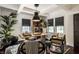 Inviting home office featuring coffered ceiling, desk, stylish seating and natural light at 5280 N Capitol Ave, Indianapolis, IN 46208
