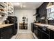 Stylish kitchen featuring black cabinetry, butcher block counters, and retro SMEG refrigerator at 5280 N Capitol Ave, Indianapolis, IN 46208