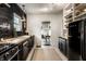 Modern kitchen with black cabinets, butcher block countertops, and stainless steel appliances at 5280 N Capitol Ave, Indianapolis, IN 46208
