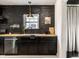 Contemporary kitchen design with sleek black cabinets, wooden countertops, and upscale appliances at 5280 N Capitol Ave, Indianapolis, IN 46208