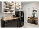 Charming kitchen with open shelving, SMEG refrigerator, and adjoining dining area at 5280 N Capitol Ave, Indianapolis, IN 46208