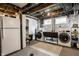 Well-lit laundry room with washer, dryer, and utility sink offering functionality and efficiency at 5280 N Capitol Ave, Indianapolis, IN 46208