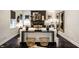 Stylish living room featuring dark hardwood floors, decorative fireplace, and contemporary furnishings at 5280 N Capitol Ave, Indianapolis, IN 46208