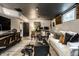 Well-appointed living room featuring stylish furniture, modern decor, and a white sofa at 5280 N Capitol Ave, Indianapolis, IN 46208
