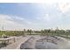Backyard deck with a partial view of the covered pool, lake and neighborhood at 5457 W 900 North, McCordsville, IN 46055