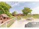 View from the spacious backyard deck to the home and play set at 5457 W 900 North, McCordsville, IN 46055