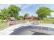 View of deck and backyard featuring a playhouse, trees, and a small table at 5457 W 900 North, McCordsville, IN 46055
