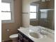 Bathroom with a modern vanity, a single sink, and a large mirror, offering a functional design at 5457 W 900 North, McCordsville, IN 46055