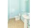 Powder room featuring blue walls, tile floor, pedestal sink, and toilet at 5457 W 900 North, McCordsville, IN 46055