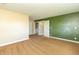 Bedroom featuring green accent wall and carpet floors at 5457 W 900 North, McCordsville, IN 46055