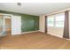 Bedroom featuring green accent wall and natural light at 5457 W 900 North, McCordsville, IN 46055