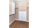 Walk-in closet with built-in shelving and drawers for organized storage at 5457 W 900 North, McCordsville, IN 46055