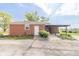 A cozy brick home with white trim, covered patio, and well-manicured yard at 5457 W 900 North, McCordsville, IN 46055