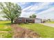 Charming single-story brick home with a well-maintained front yard, mature trees and an attached garage at 5457 W 900 North, McCordsville, IN 46055