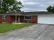 Charming brick ranch home with an attached garage and well-maintained front yard at 5457 W 900 North, McCordsville, IN 46055