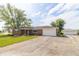 Charming single-story brick home with attached garage, mature trees, and a long driveway at 5457 W 900 North, McCordsville, IN 46055