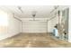 Garage with painted floors, side utility door and equipment, and automatic door at 5457 W 900 North, McCordsville, IN 46055