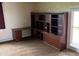 Office room showcasing custom built-in shelves and drawers, and a sliding glass door at 5457 W 900 North, McCordsville, IN 46055