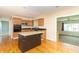 Modern kitchen features an island, stainless appliances, ample counter space, access to the living room at 5457 W 900 North, McCordsville, IN 46055