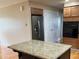 Kitchen boasts a granite island, wooden cabinets, and stainless steel appliances at 5457 W 900 North, McCordsville, IN 46055