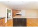 Bright kitchen featuring a center island and hardwood floors at 5457 W 900 North, McCordsville, IN 46055