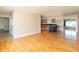 Open floor plan with hardwood floors connecting living room and kitchen at 5457 W 900 North, McCordsville, IN 46055