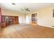 Comfortable living room with large windows, a ceiling fan and easy access to the kitchen and backyard at 5457 W 900 North, McCordsville, IN 46055