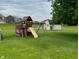 This playground has a slide, swing set, and playhouse adding recreational fun to the backyard space at 5457 W 900 North, McCordsville, IN 46055