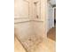 Tiled shower stall with neutral color scheme and handrails for accessibility at 5457 W 900 North, McCordsville, IN 46055