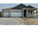 Charming single-story home with a two-car garage and inviting covered entry at 5863 Handbell Ln, Greenwood, IN 46143