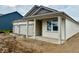 Attractive single-story home with a three-car garage and covered porch entry at 5863 Handbell Ln, Greenwood, IN 46143