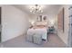 Spacious bedroom with neutral decor, unique lighting, stylish artwork, and a comfortable atmosphere at 591 Dalton Way, Avon, IN 46123