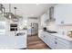 Bright kitchen with quartz countertops, subway tile backsplash, stainless appliances and contemporary pendant lighting at 591 Dalton Way, Avon, IN 46123